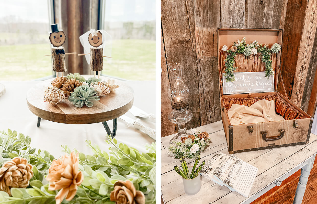 Rustic wedding decor with wooden cake toppers and a vintage suitcase card box, adorned with flowers and greenery.