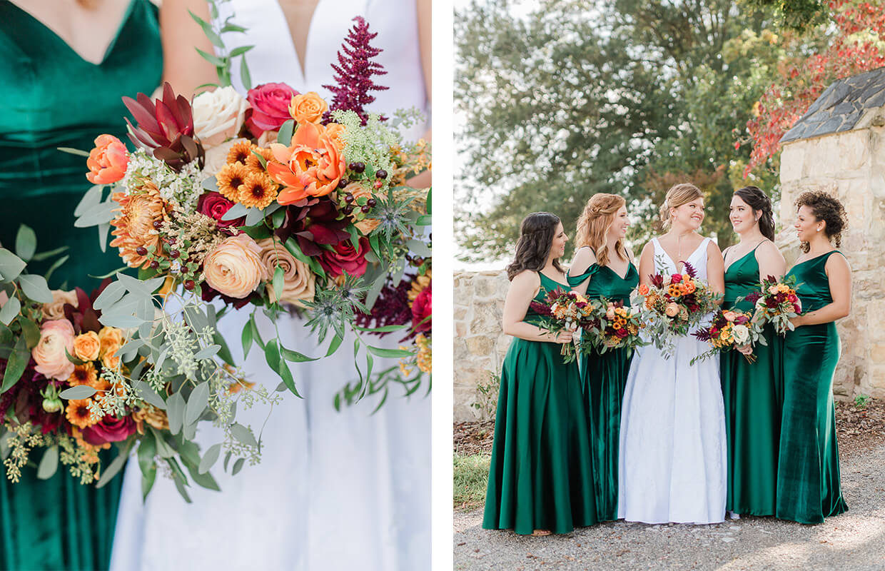 Five women in formal dresses, one in white and others in green, hold colorful flower bouquets. They're standing outdoors on a stone path near a wall with greenery in the background.