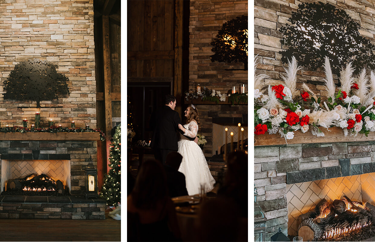 A bride and groom dance near a decorated stone fireplace with garland, candles, and red and white floral arrangements.