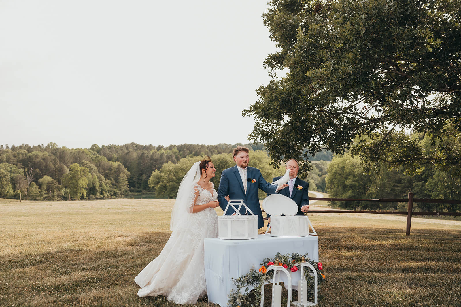A couple celebrating their wedding vows with a dove release at Experience Oakhaven.
