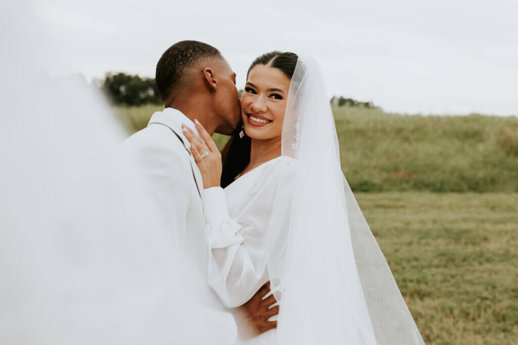 A wedding couple outside at Oakhaven, a Pelham NC country estate wedding venue.